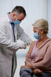 © Space_Cat - Elderly woman receiving vaccine. Medical worker vaccinating senior patient against coronavirus, influenza, flu or pneumonia