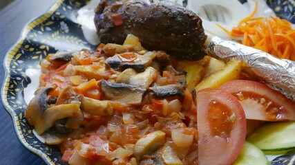 Sticker - bone-in meat with vegetables on a plate