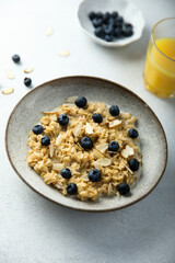 Sticker - Homemade oatmeal porridge with blueberry and almond flakes