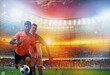 © alphaspirit - Soccer players play with soccerbal at the stadium