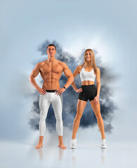 Wall Mural - Fit couple at the gym isolated on white background. Fitness concept. Healthy life style.