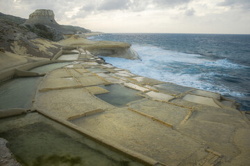 Coast with water and sky in late day on island of Malta, Gozo