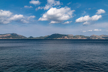 Sailing from boat with coast in horizon during clear day in Spain, Mallorca