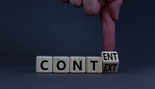 Content And Context Symbol. Businessman Turns A Wooden Cube And Changes The Word Context To Content. Beautiful Grey Table, Grey Background. Business And Content And Context Concept. Copy Space.
