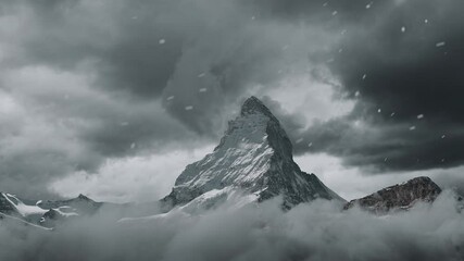 Leinwandbilder - view to the majestic Matterhorn mountain covered with clouds and snow