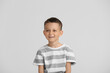 © Pixel-Shot - Portrait of happy little boy on light background