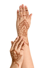 Wall Mural - Beautiful female hands with henna tattoo isolated on white background