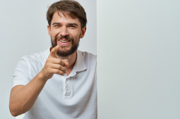 Wall Mural - handsome man in a white t-shirt mockup poster discount advertising copy-space studio