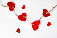 Red Hearts On Rope On A White Background