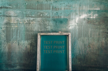 Wall Mural - Screen printing film in workshop standing against the green background