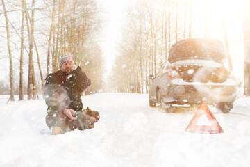 Man and car. Winter walk and car repair.