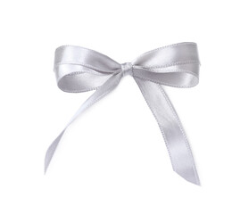 silver satin ribbon tied in bow on white background, top view