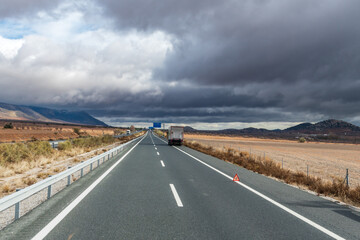 Wall Mural - Damaged truck on a highway with the warning sign posted well in advance.