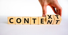 Content And Context Symbol. Businessman Turns Wooden Cubes And Changes The Word Context To Content. Beautiful White Table, White Background. Business And Content And Context Concept. Copy Space.
