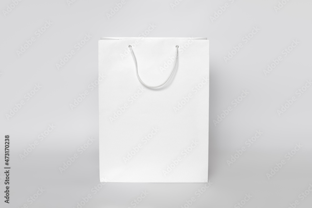 Mockup of white shopping bag isolated over white paper background ...