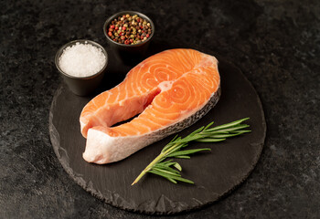 raw salmon steak on stone background 