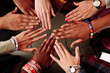 Palms up hands of happy group of multinational African, latin american and european people which stay together in circle