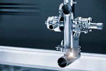 Poster - Pipelines from stainless steel, a system for pumping liquids or milk for the food industry. Abstract industrial background.