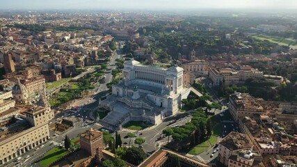 Wall Mural - Aerial drone video of iconic monument in Venice square called Altar of the Fatherland, Rome historic centre, Italy