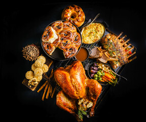 Wall Mural - Festive Platter of roasted turkey, rack of lamb with colorful vegetable, Chelsea cinnamon raisin bun and mince pie. Celebrate Thanksgiving, Christmas or New Year Party Concept. Top view, Flat Lay shot