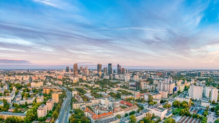 Wall Mural - Aerial view of Warsaw distant city center at sunset from Wola