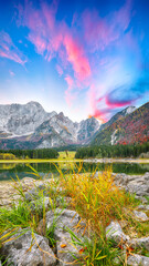 Astonishing view of Fusine lake with Mangart peak on background.