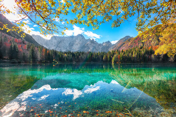 Breathtaking view of Fusine lake with Mangart peak on background