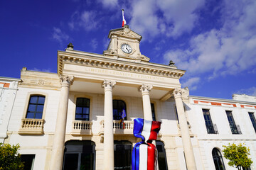 city hall in town center of arcachon with french flag on candy text liberte egalite fraternite means freedom equality fraternity on town hall building