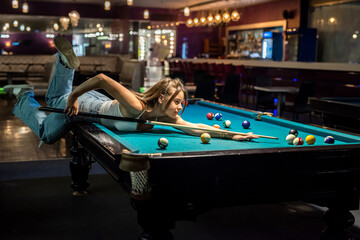 Wall Mural - happy woman spend free time at pub, playing in snooker