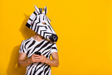 Fototapeta Konie - Profile side photo of weird guy in zebra mask blog use smart phone chatting empty space isolated over yellow color background