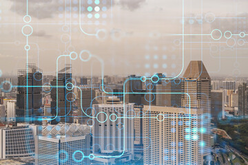 Glowing hologram of technological process, aerial panoramic cityscape of Singapore at sunset. The largest innovative hub of tech services in Southeast Asia. Multi exposure.
