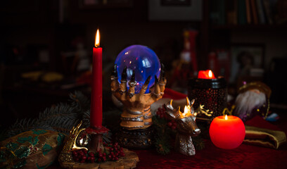 Winter Christmas prediction on a Candle and Tarot cards. Magical esoteric concept. Astrology and wicca rituals