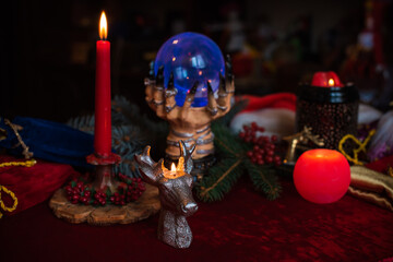 Winter Christmas prediction on a Candle and Tarot cards. Magical esoteric concept. Astrology and wicca rituals