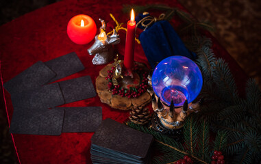 Winter Christmas prediction on a Candle and Tarot cards. Magical esoteric concept. Astrology and wicca rituals