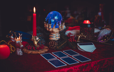 Winter Christmas prediction on a Candle and Tarot cards. Magical esoteric concept. Astrology and wicca rituals