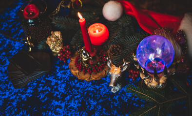 Winter Christmas prediction on a Candle and Tarot cards. Magical esoteric concept. Astrology and wicca rituals