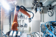 Illuminated Robotic Arm Working In Automated Industry