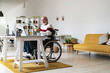 © Westend61 - Senior disabled businessman with mobile phone and laptop at home office
