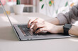 © Jun - A career woman who works on a laptop.