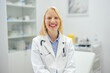 © bnenin - Portrait of happy medical worker, smiling for the picture, in her clinic.