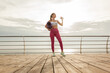 © splitov27 - Fit woman drinks water on the beach. Healthy lifestyle