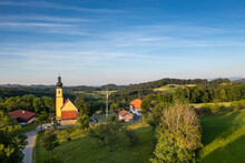 Germany, Bavaria, Irschenberg, Drone View O FChurch Of Blessed Virgin Mary's Birth And Surrounding Landscape