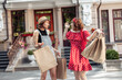 © splitov27 - Two female friend have a shopping in the city. Attractive girls with shopping bags