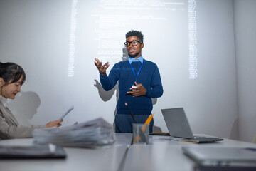 Poster - Young confident businessman making presentation by interactive whiteboard while standing in front of audience