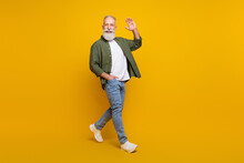 Full Length Body Size Photo Of Positive Happy Senior Man Smiling Waving Hand Isolated Vivid Yellow Color Background