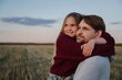 © Westend61 - Daughter embracing father while looking at sunset
