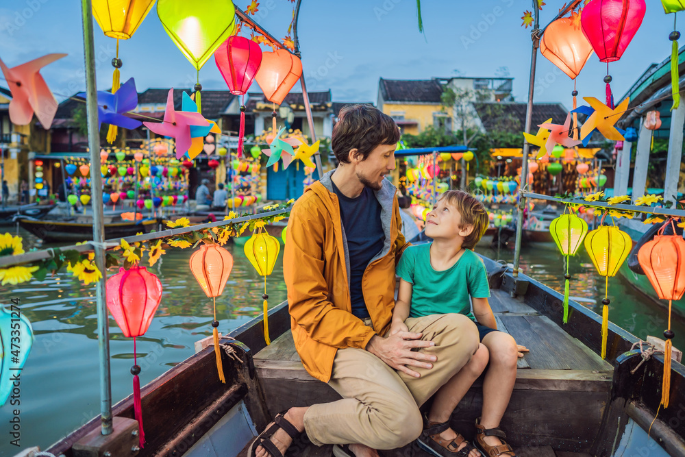 Happy family father and son of travelers ride a national boat on ...
