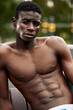 © Georgii - strong muscular black man with naked torso, bodybuilder concept. african sportsman having strong abdominal abs. Close-up portrait, copy space. people, workout, sport