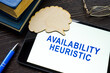 Tablet with words availability heuristic and brain shape.