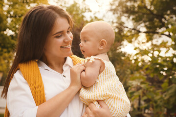 Canvas Print - Happy mother with adorable baby walking on sunny day